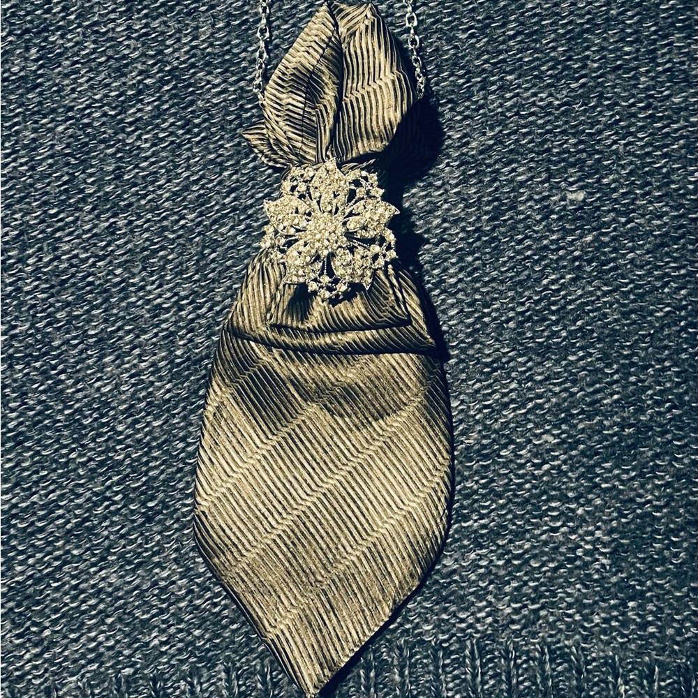 Elegant Gold Tie with Silver Brooch